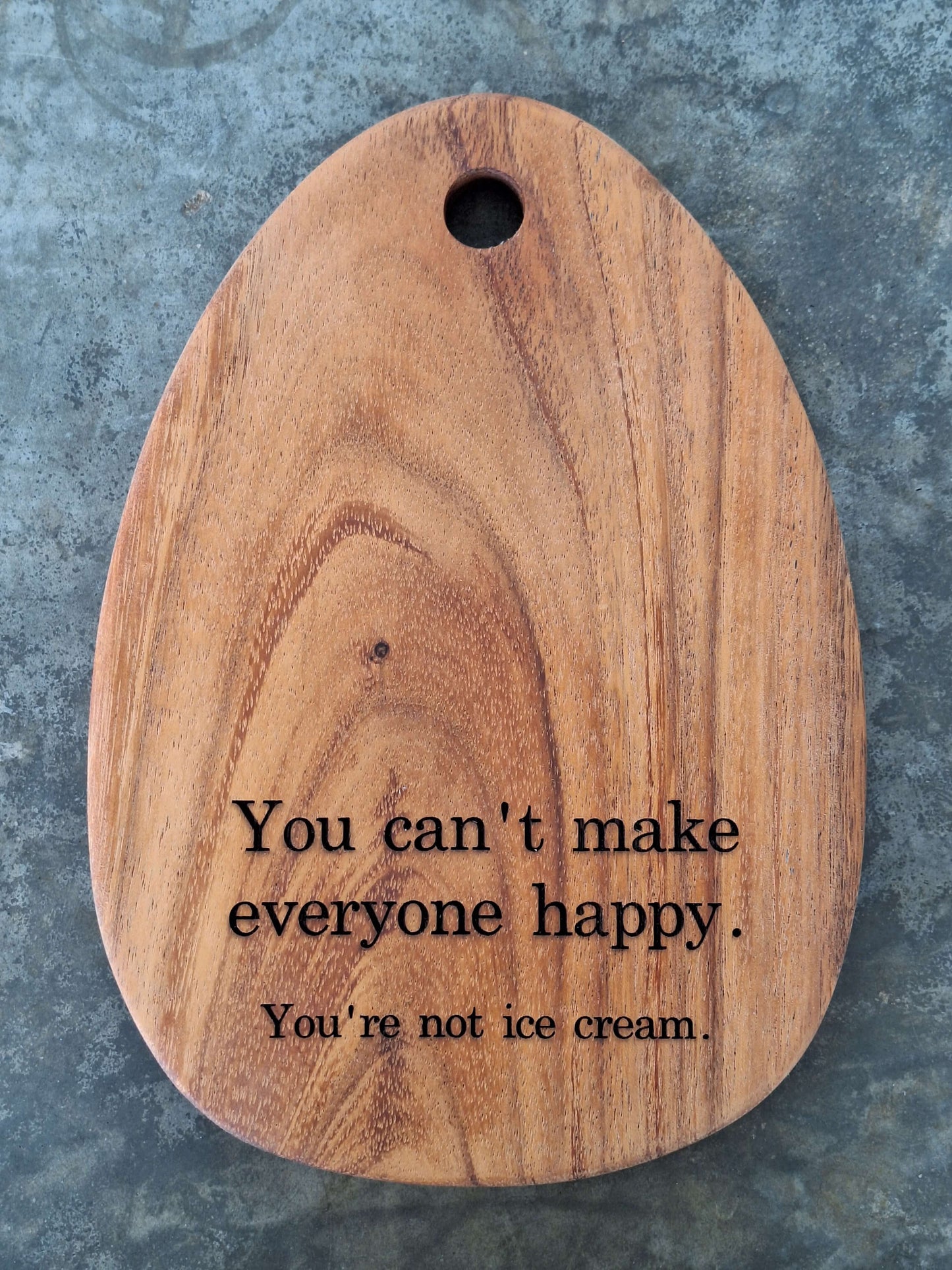 Egg shaped tiny cutting board engraved with the humor quote "you cannot make everyone happy, you are not ice cream"