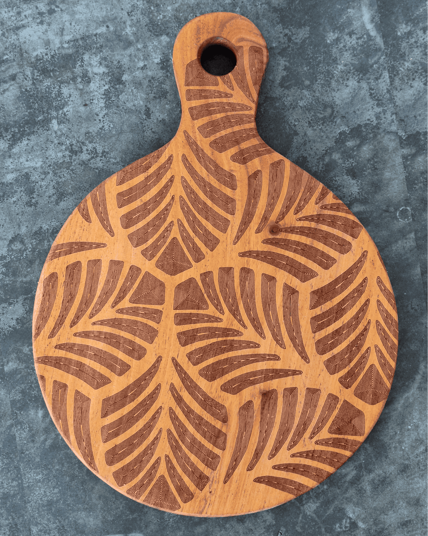Tiny paddle shaped cutting board with tropical leaves laser engraved