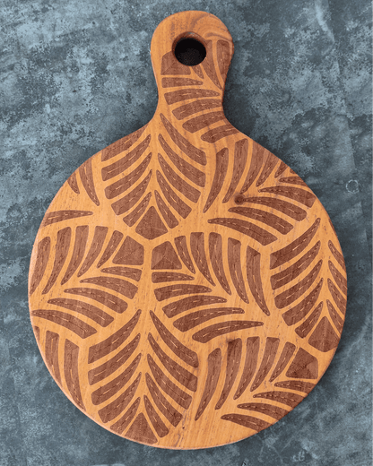 Tiny paddle shaped cutting board with tropical leaves laser engraved