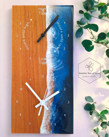 Rectangular double clock with a tide clock and a rectangular clock, diplayed with eucalyptus leaves, light and shadows