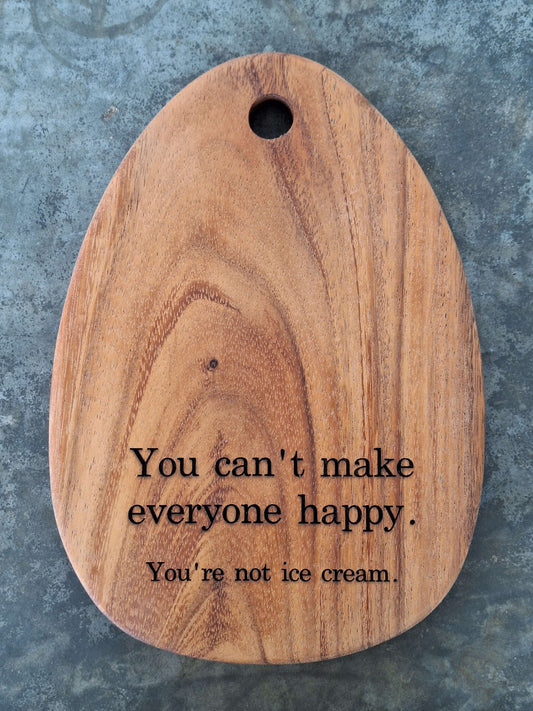 Egg shaped tiny cutting board engraved with the humor quote "you cannot make everyone happy, you are not ice cream"